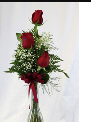 Three red roses in vase